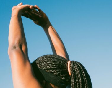 person raising her hands